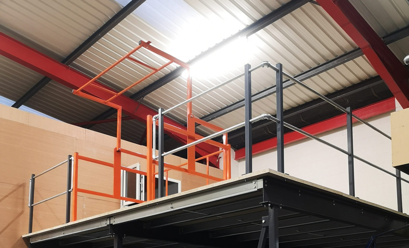 Standard Pallet Gate installed on a small mezzanine floor with handrailing